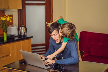 Man is trying to work from home because of the coronovirus epidemic, but his son is stopping him....