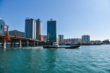 Fototapeta premium Busan city, South Korea - OCT 31, 2019: Tourists near drawbridge- Yeongdodaegyo Bridge in Jung-gu, Busan