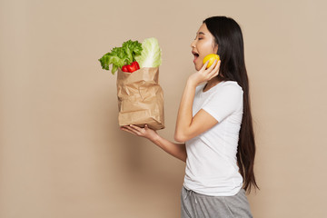 young woman with fruits and vegetables