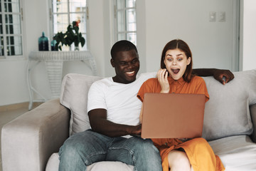 couple using laptop at home