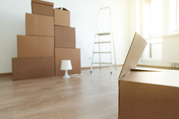 Cardboard boxes for moving in interior apartment,