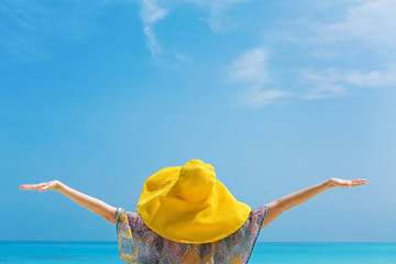 Woman in yellow summer hat on beach , closeup