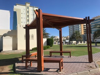 Gazebo at an Children park where parents can rest while kids are playing around and made of red...