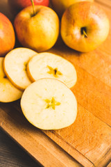 Close-up apples on the rustic wooden background. Selective focus. Shallow depth of field.