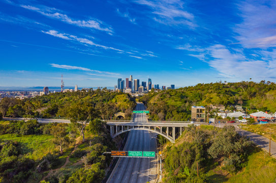 Aerial view of empty freeway streets with no vehicles and people in downtown Los Angeles California USA due to coronavirus pandemic or COVID-19 virus outbreak and quarantine