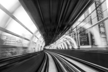 Fototapeta na wymiar Motion blur of train moving inside tunnel