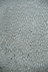 Concrete background with jagged pattern.