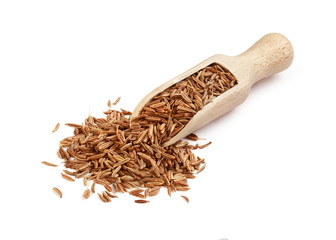 Caraway seasoning in a wooden spoon on a white background