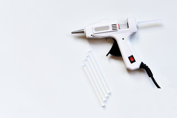 Hot melt glue gun on white background