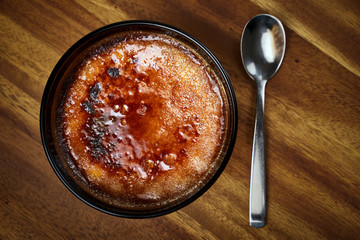 Creme brulee on wooden board
