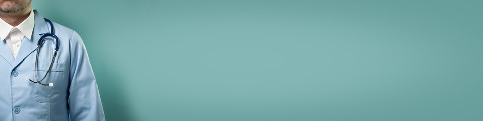 Doctor in professional medical suit with stethoscope on blue background