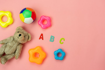 Table top view decoration kid toys for develop background concept.Flat lay accessories baby to play with items child on modern pink paper at office desk.Copy space for add text.pastel tone wallpaper.
