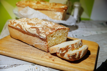 Homebaked bread. Sliced ​​pieces of bread. Home kitchen. We bake bread at home.