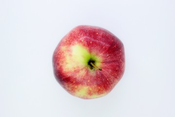 Beautiful red juicy apple located on a gray background