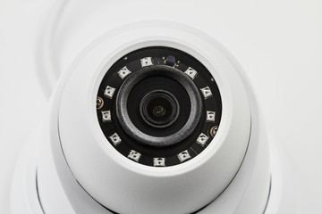 Dome secure camera on light background with motion sensors. Video surveillance camera. Closeup, selective focus © marketlan