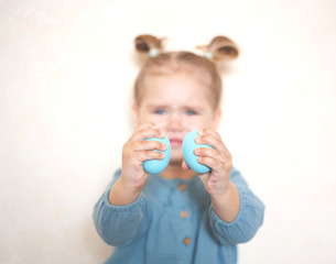 blue-eyed blonde girl with a basket of Easter eggs in a vintage dress