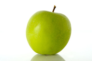 Close up green Apple granny smith isolated on white background with reflection
