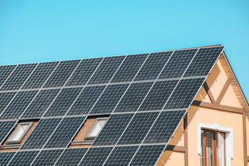 solar panels, Close up shot of a solar panel array with blue sky, Solar panels on a roof for...