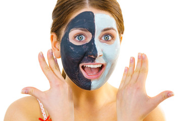 Girl with black white mud mask on face