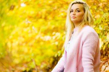 Sad woman in autumn park