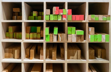 The stock of lumbers in a wood shelf. Detail of wood blocks in storage.
