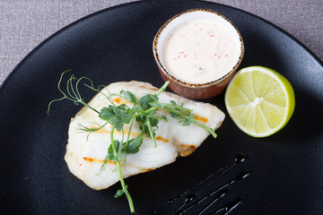 White fish fillet served with lime