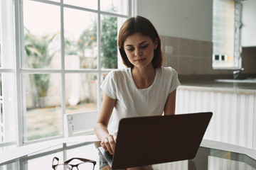 young woman working on laptop