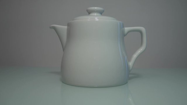 Aesthetic teapot product reveal sliding shot 