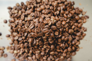 Roasted coffee beans pile. From top view