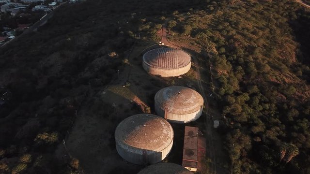 4K aerial drone video savanna hills, old historical water storage reservoirs in Klein Windhoek residential suburb in Namibia's capital in central highland Khomas Hochland of Namibia, southern Africa