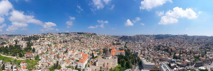 Aerial panoramic image of the Basilica of the Annunciation over the old city houses of Nazareth
