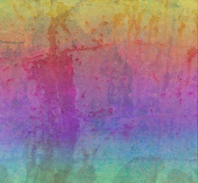 Rainbow grunge background texture, old damaged peeling paint and rusted metal background in blue green yellow red pink purple and orange colors, colorful vintage design