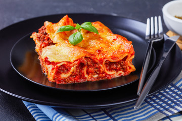 Stuffed pasta manicotti with bolognese on a plate