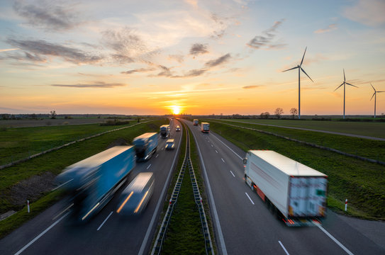 truck traffic on the highway at sunset