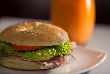 closeup of Ham and cheese sandwich with orange juice. Food photography.