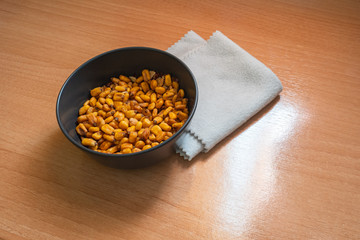 Nuts in a black bowl.