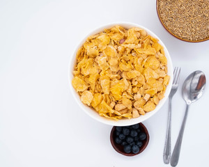 cereal in a white bowl on background. Healthy breakfast concept.
