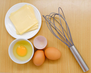Close-up view of raw chicken eggs on background
