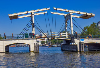 Fototapeta premium Drawbridge on the river in Amsterdam