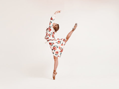 Ballet dancer, classic ballerina dancing isolated on white studio background.