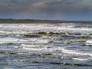 Ocean waves and cloudy sky. Strandhill, county Sligo, Ireland.