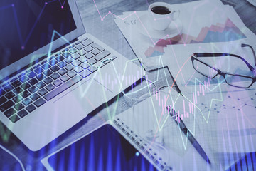 Fototapeta premium Stock market graph and table with computer background. Double exposure. Concept of financial analysis.