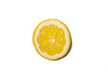 Lemons on white background. Pieces of lemons and whole lemons, with little shadow. Groups of yellow lemons on white