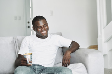 man of african appearance at home in front 