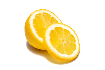 Lemons on white background. Pieces of lemons and whole lemons, with little shadow. Groups of yellow lemons on white