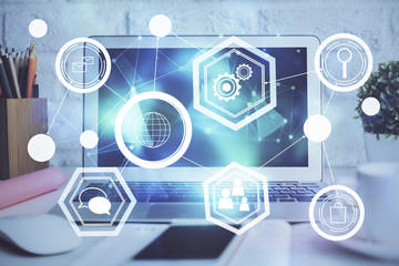 Computer on desktop with social network hologram. Double exposure. Concept of international people connections.