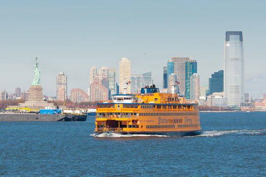 New York City, USA - November 18, 2011: Staten Island Ferry in New York Harbor with the Statue of Liberty in the background on November 18, 2011.