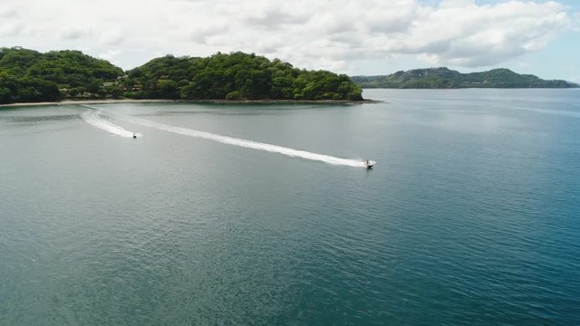 Aerial shot of Jet Ski near the tropical beach Playa Arenillas in Costa Rica in peninsula Papagayo coast in guanacaste