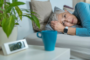 Worried woman having Sleeping Difficulty Caused with Caffeine Use before Bed