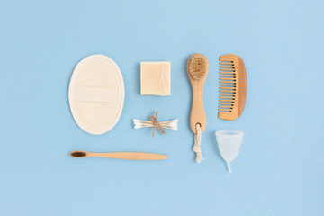 Layout of zero waste accessories for personal hygiene on a blue background. Plastic free concept.